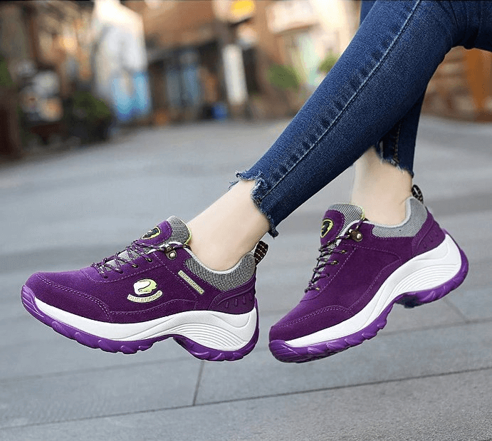 Eye-catching purple suede women's sports shoes with lace-up design for comfort and stability, featuring stylish animal print accents.